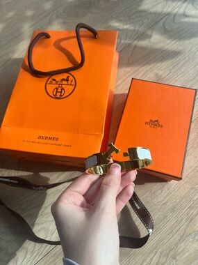 Hermès Clic H Bracelet in Gold and White